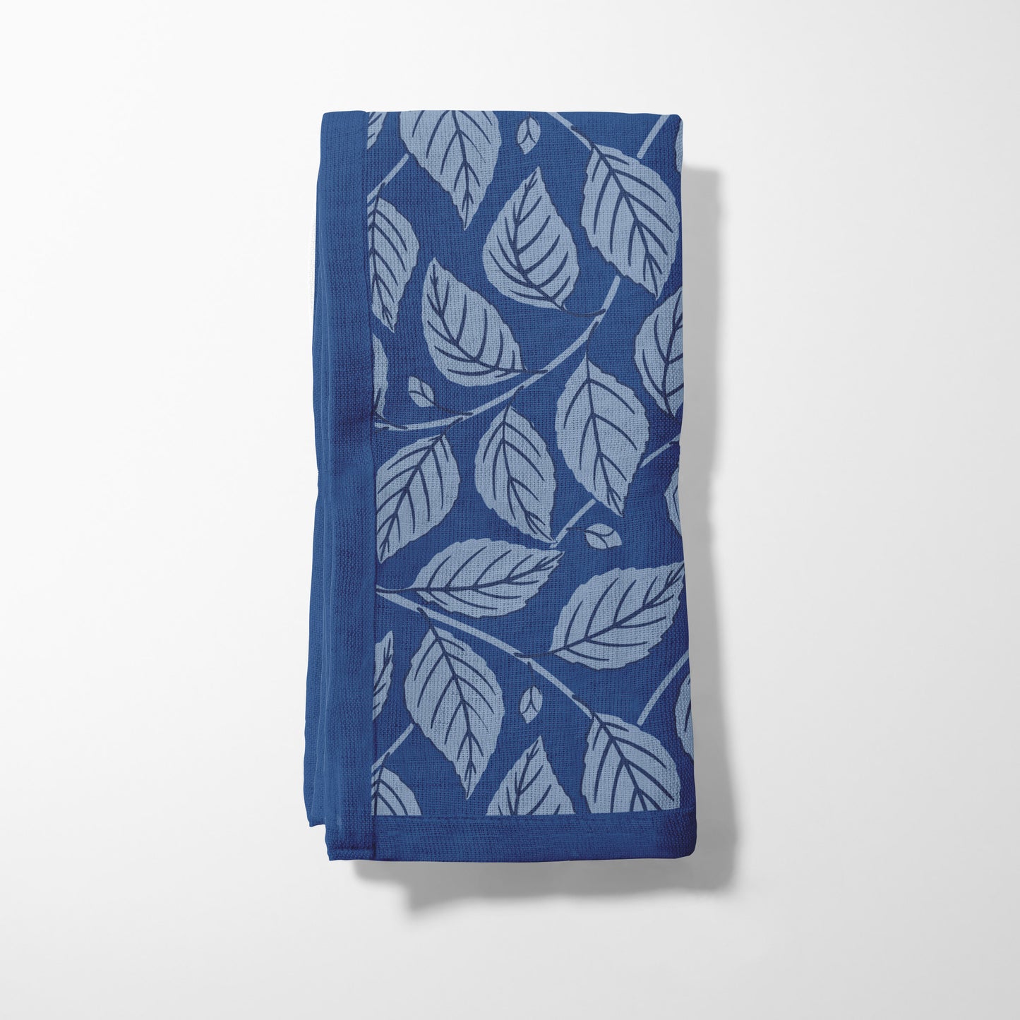 Bowing Birch Leaves in Blue Napkin in Lightweight Linen