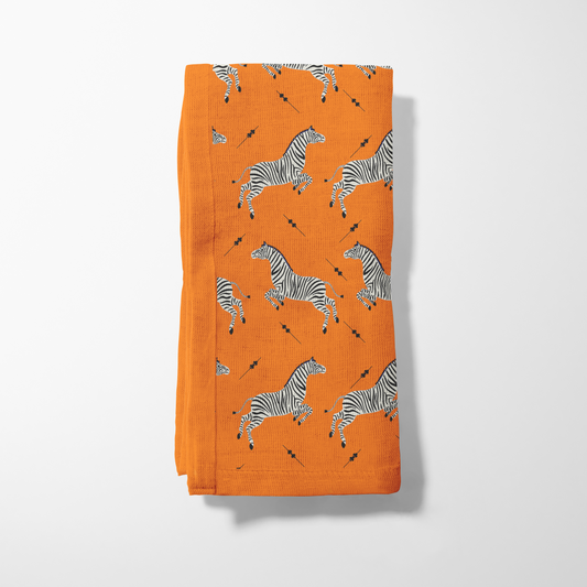 Leaping Zebras Napkin in Burnt Orange
