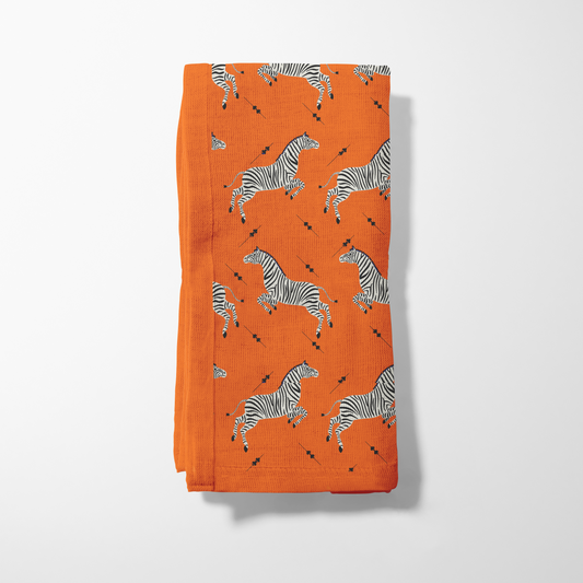 Leaping Zebras Napkin in Vibrant Orange in Organic Cotton Voile