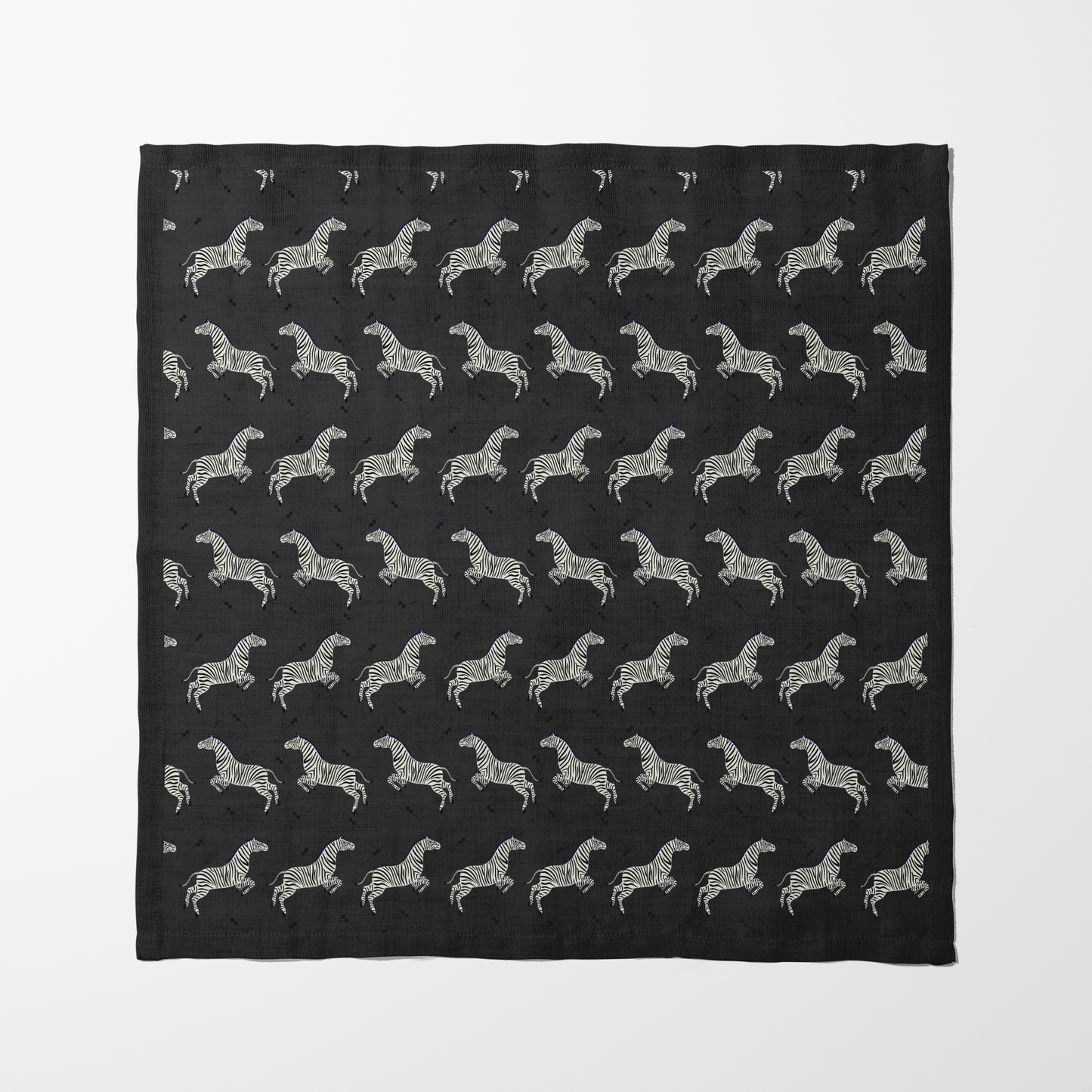 Leaping Zebras Napkin in Dark Grey in Lightweight Linen