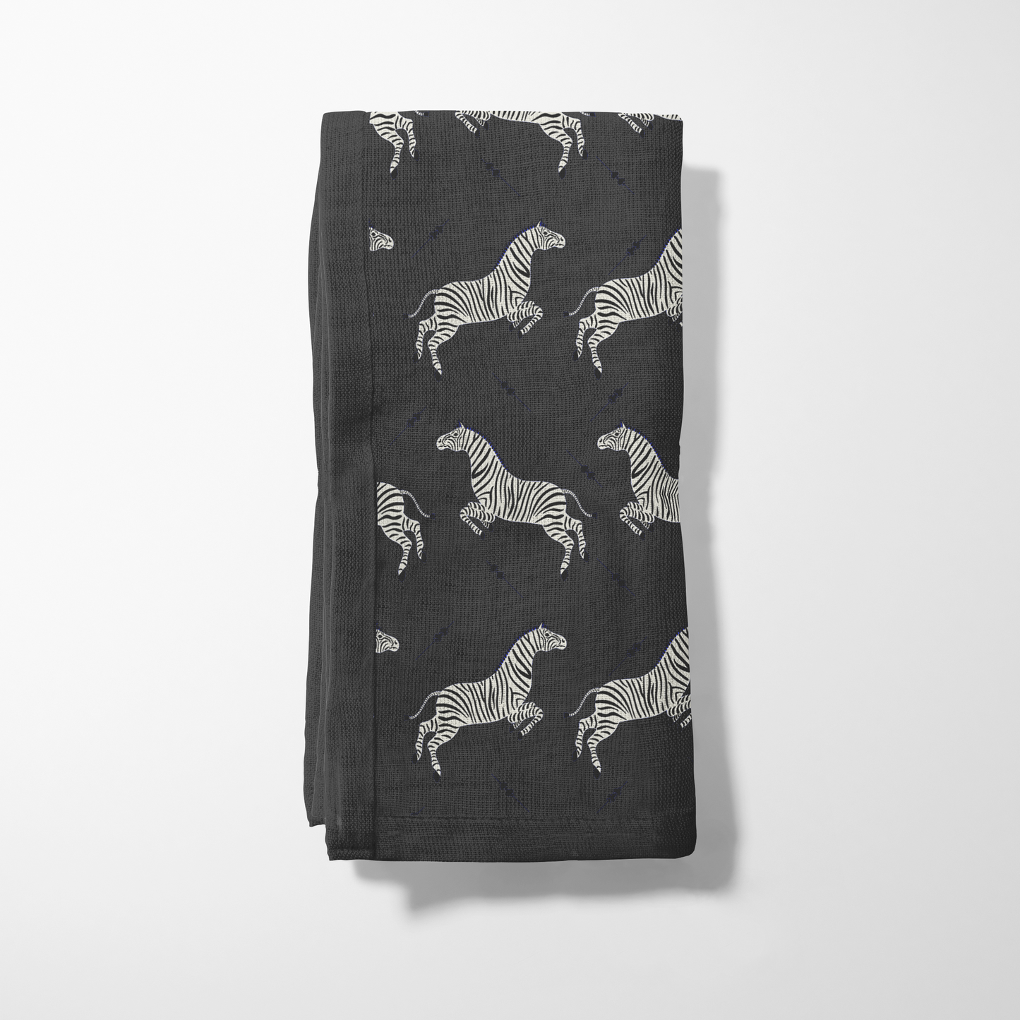 Leaping Zebras Napkin in Dark Grey in Organic Cotton Voile